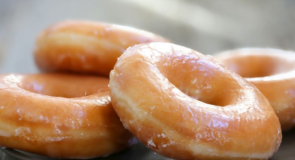 Close up of pile of glazed donuts. San Diego gluten free donuts.