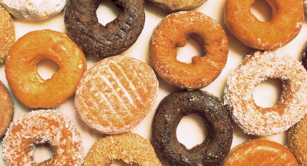 Close up of donuts, glazed donuts, power sugar donuts, chocolate donuts. San Diego donuts near me.