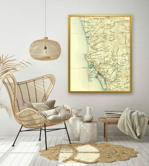 Living room with wicker furniture and vintage map of San Diego on a white wall