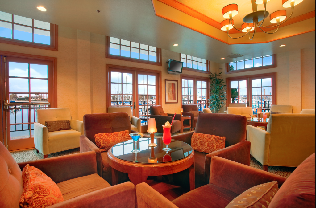 A orange tinted lobby with elegant decor and natural light