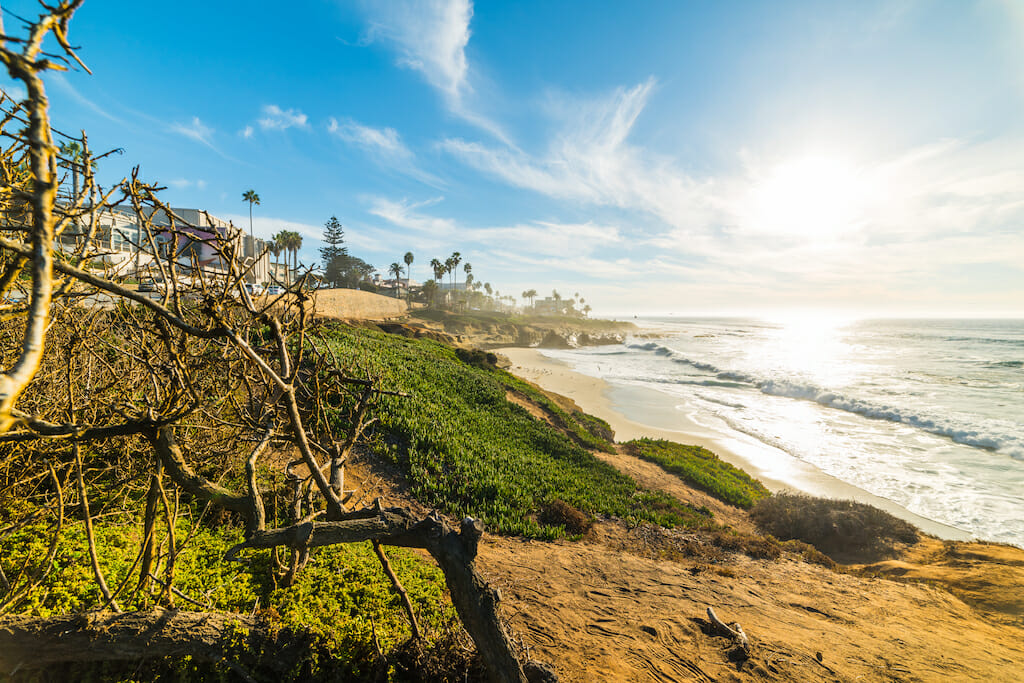 Sun shining over famous La Jolla beach at sunset. San Diego, California