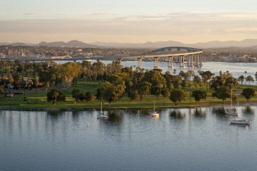 Dawn arrives at Coronado Island revealing the bay, golf course, village and coronado bridge.