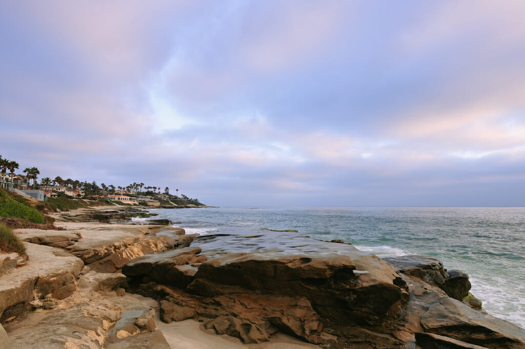 Colorful sky swirling above the ocean and La Jolla shores