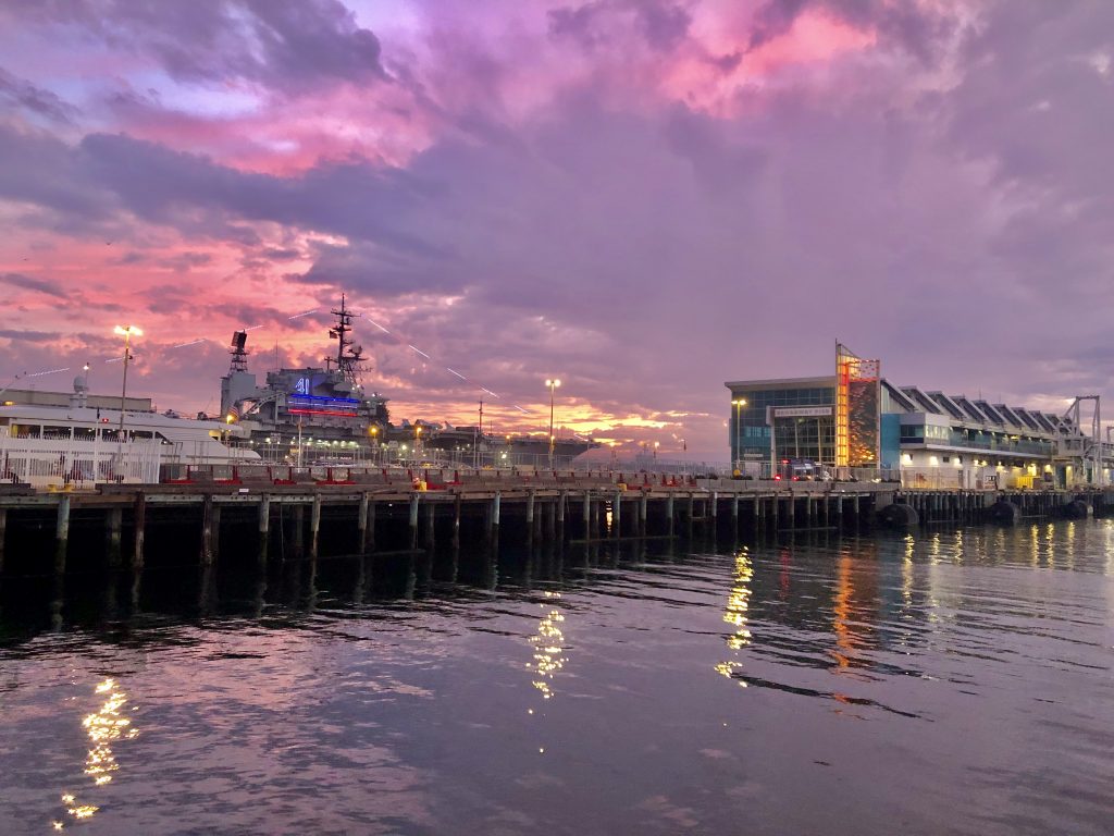 Broadway Pier San Diego at sunset with purple rain clouds