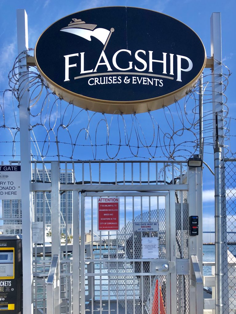 Entrance to San Diego Ferry Convention Center Landing with big metal door and barbed wire on top