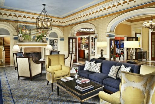 The main lobby of a hotel with pastels all around and elegant decor