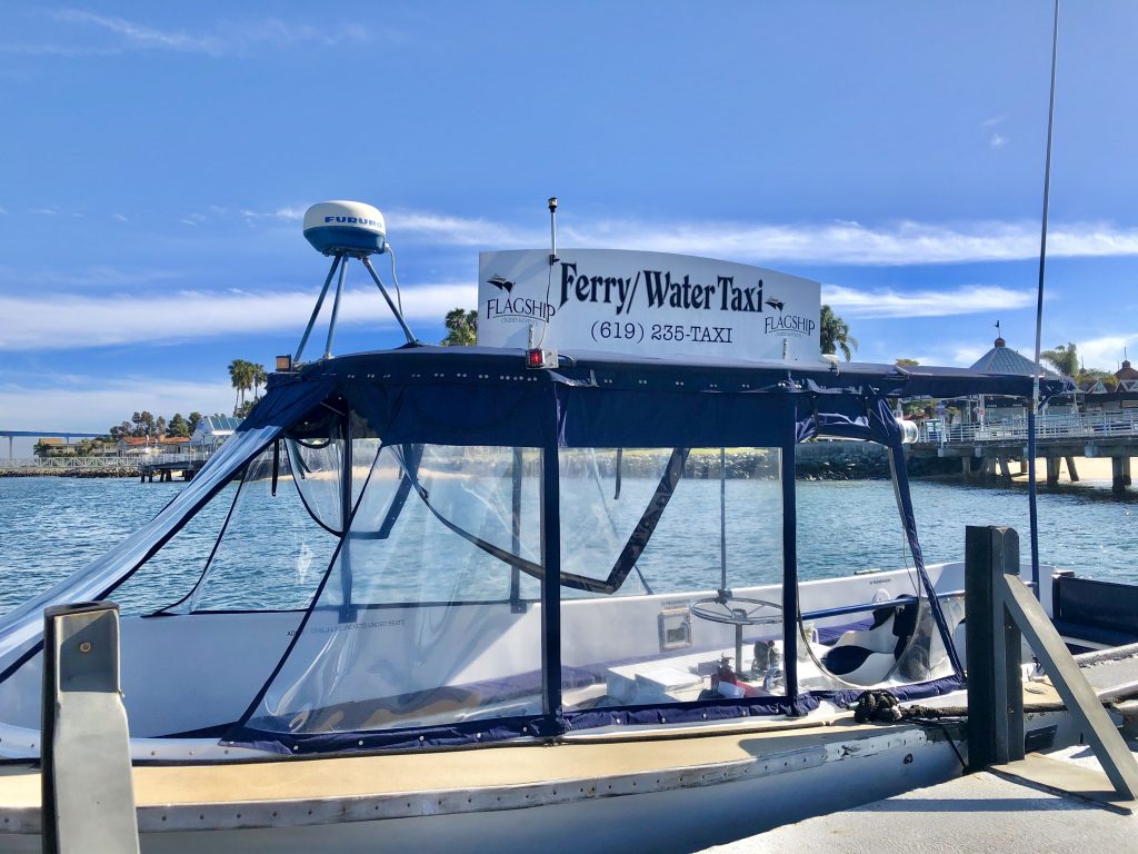 Small white boat on pier - San Diego Water Taxi Coronado Ferry