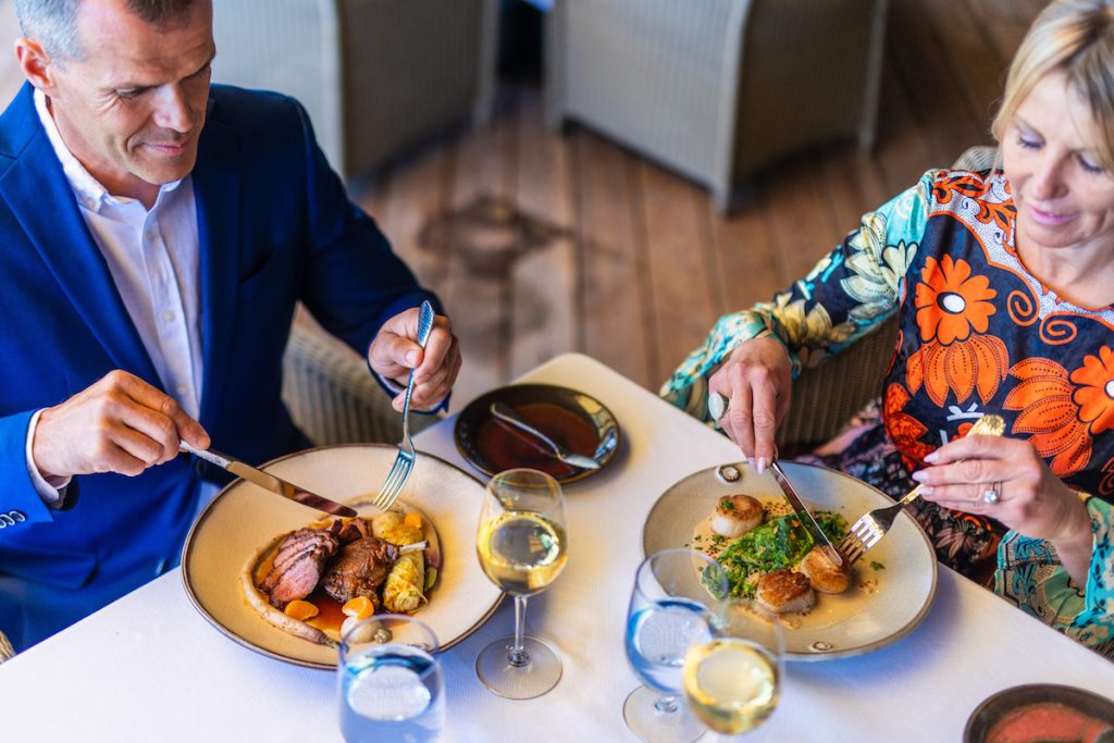 Couple eating meal at fine dining restaurant. Easter Brunch In San Diego, The Lodge At Torrey Pines, A.R. Valentien.