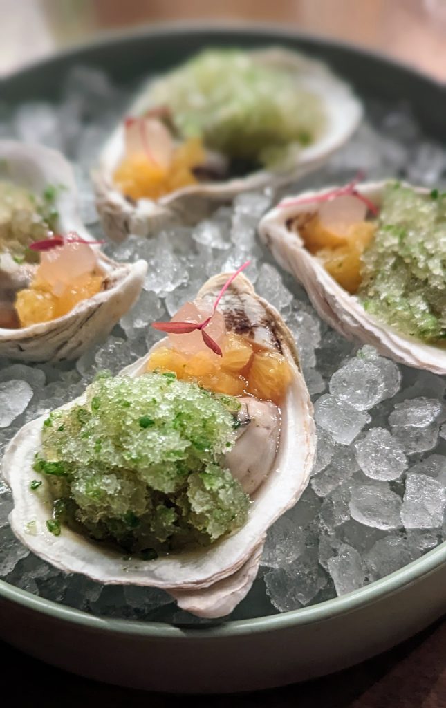 4 oysters on a plate of ice at wormwood san diego