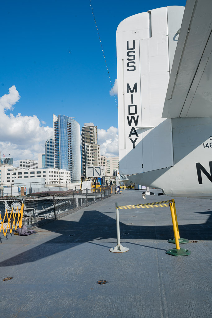 Airplane tail on the airplane hanger on the aircraft carrier in front of San Diego downtown