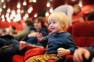 cute,toddler,boy,watching,cartoon,movie,in,the,cinema.,leisure/entertainment