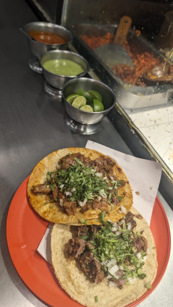 Selection of tacos and salsas at a taco shop in Mexico City