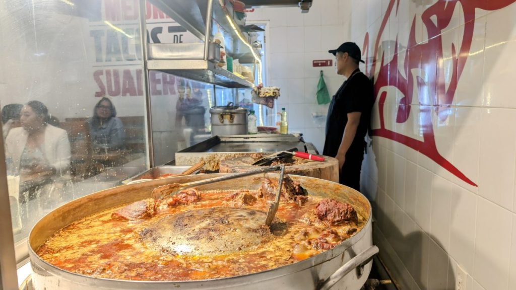 Big pot of stewing meat at a taco shop in Mexico City