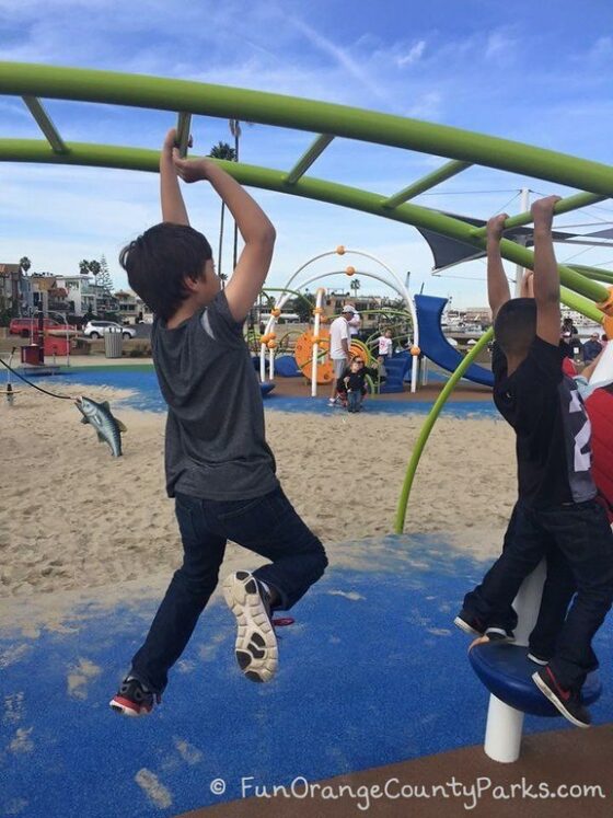 2 boys on monkey bars at Marina Park playground