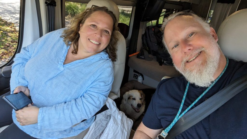 Greg, Maria and Robby in the campervan by Roadsurfer