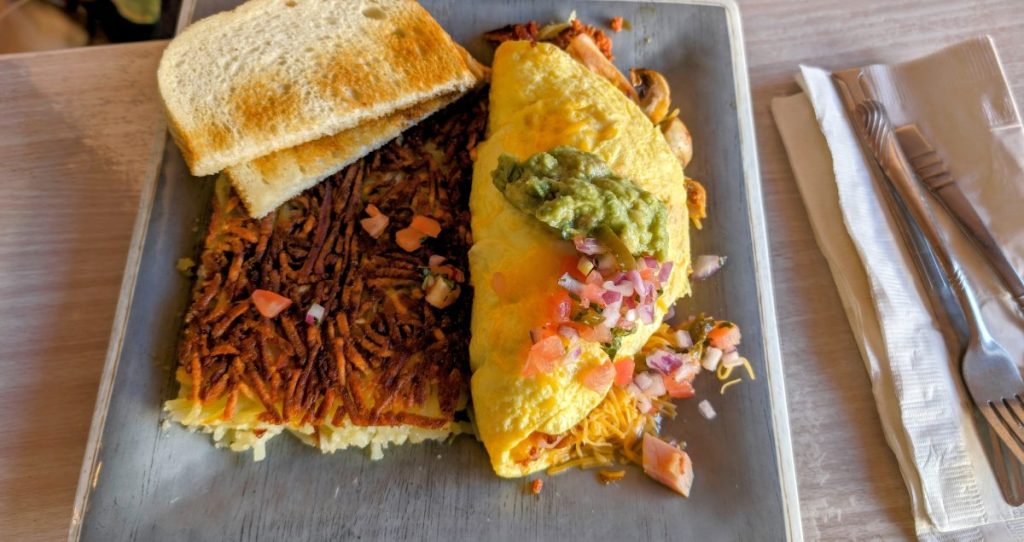 breakfast with omlette, hashbrowns and toast