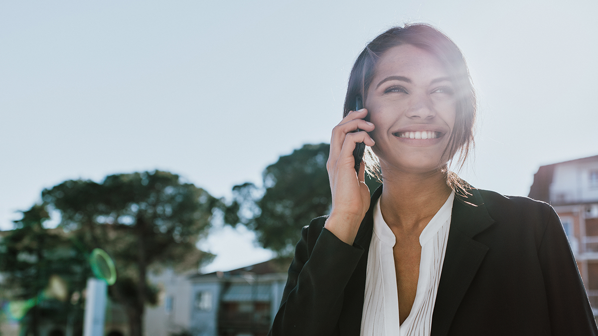 Woman circle prospecting outside a recent listing