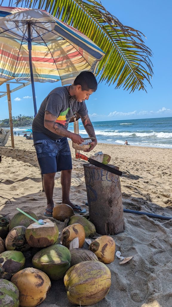 Coconut vendor on the beach in San Francisco Riviera Nayarit