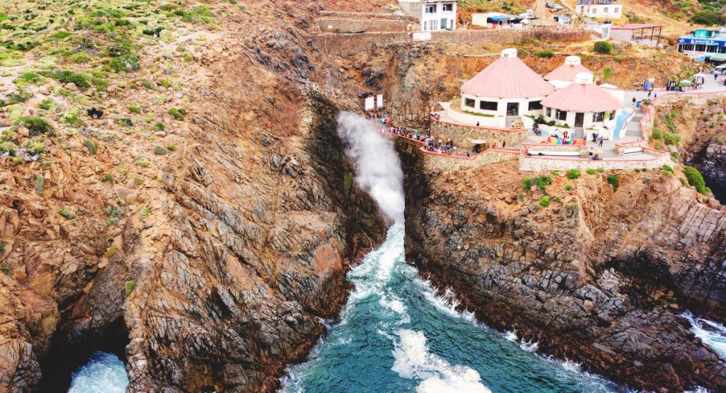 Aerial shot of La Bufadora Blowhole on the ocean cliffs in Ensenada