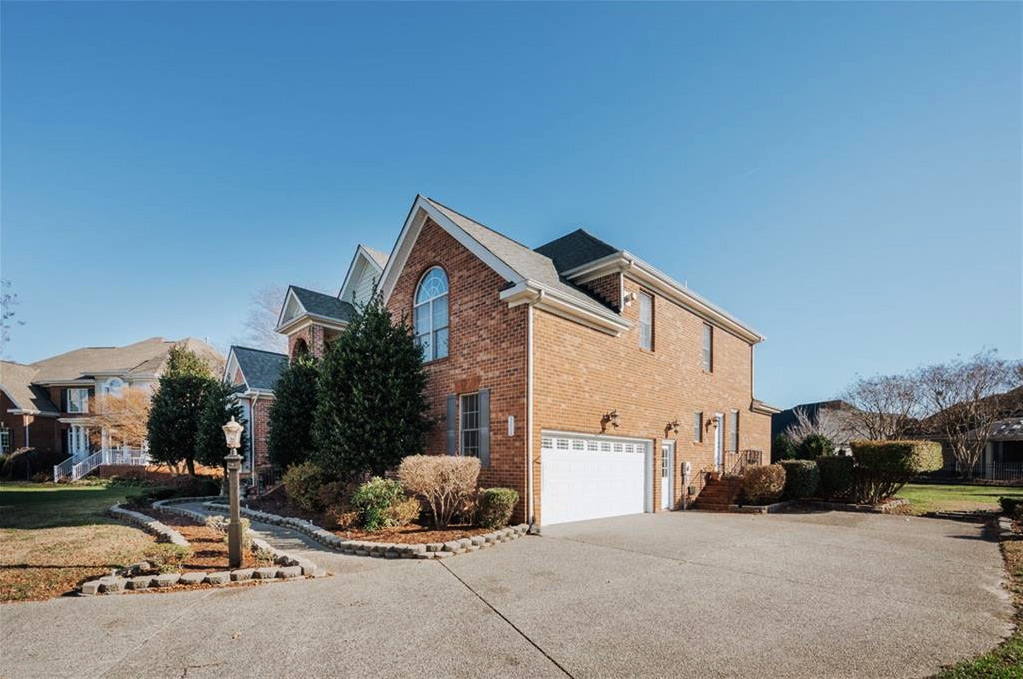 side view of 2 story house located at 3206 Stone Harbour Court, Suffolk, Virginia 23435