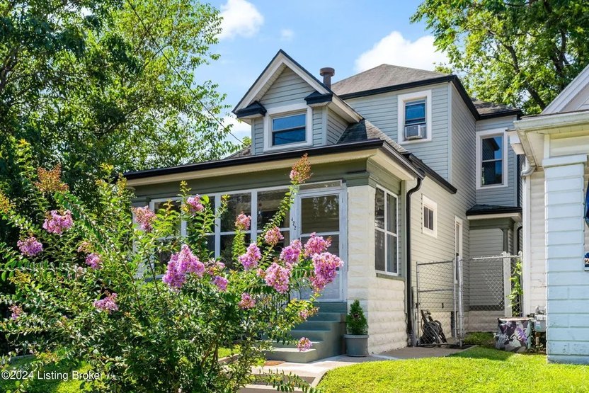 two story home with screened in porch