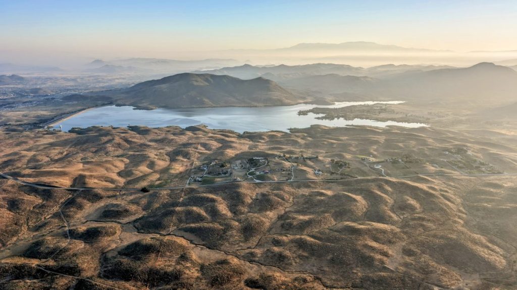 view over vineyards and Lake Skinner during Hot Air Balloon Temecula Ride at sunrise