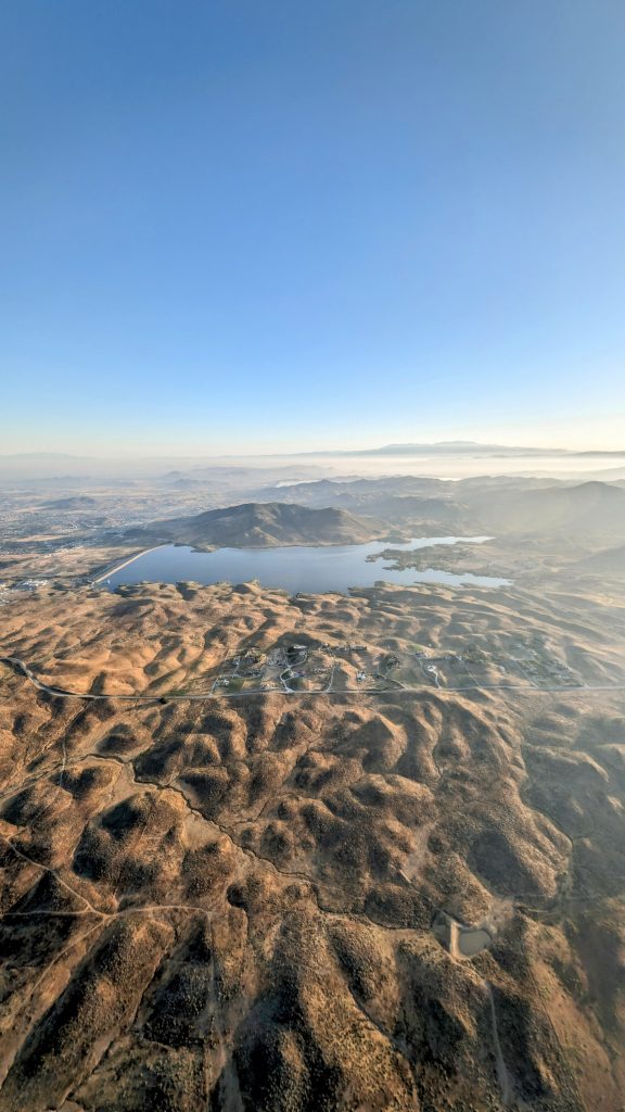 view over vineyards and Lake Skinner during Hot Air Balloon Temecula Ride at sunrise