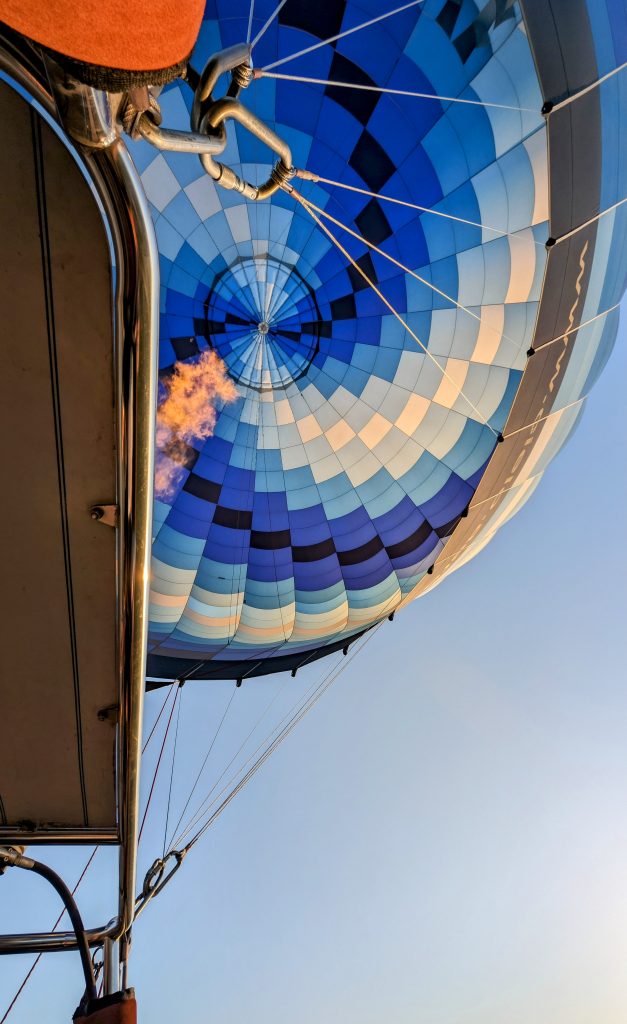 shot of hot air balloon with flame from basket