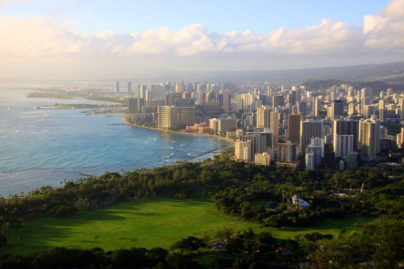 Shot from peak of Diamond Head Crater, overlooking Honolulu skyline and Waikiki Beach.