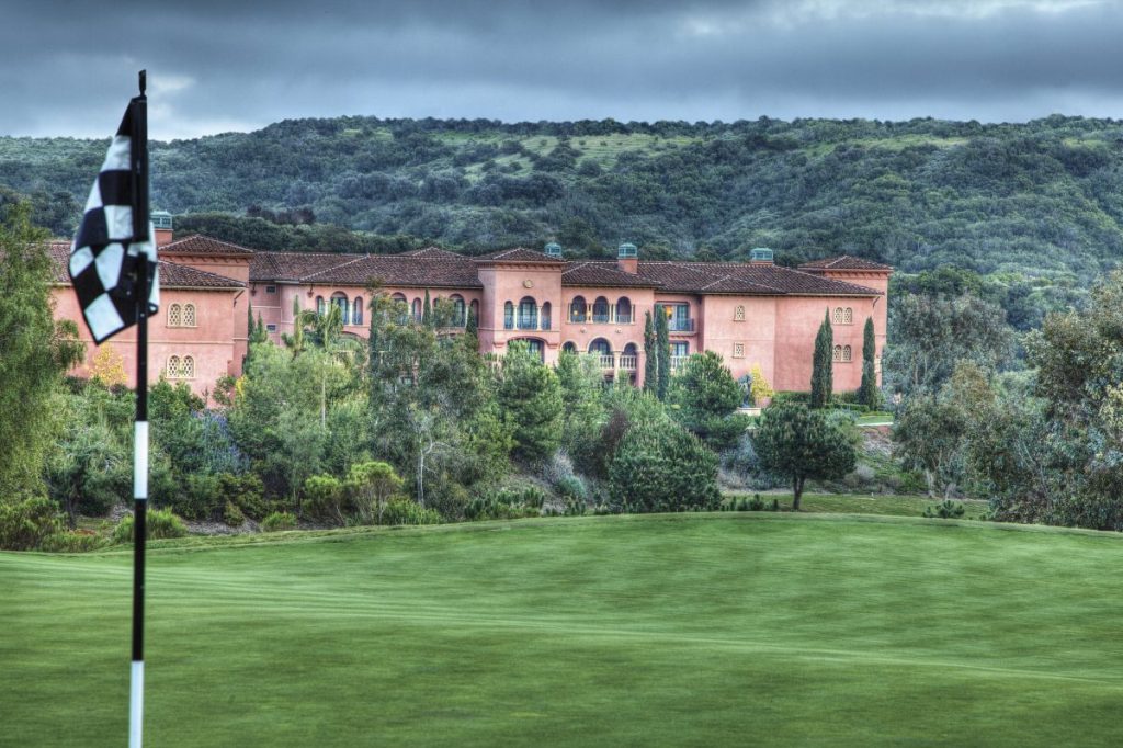 View of golf course in front with Fairmont Grand Del Mar 5 Star Hotel in background