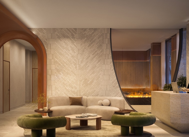 A contemporary lobby featuring a beige sofa, green chairs, a coffee table, and a fireplace with modern decor.