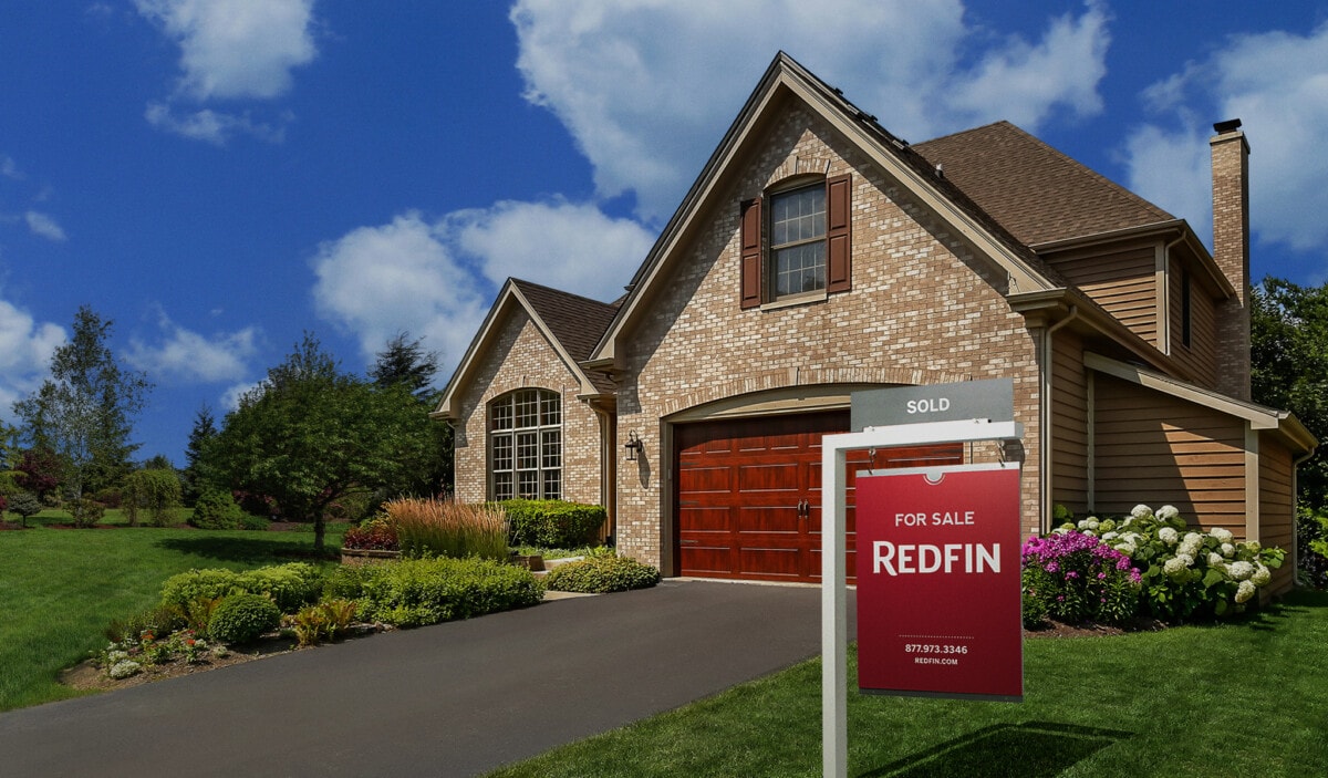 Home with a for sale sign