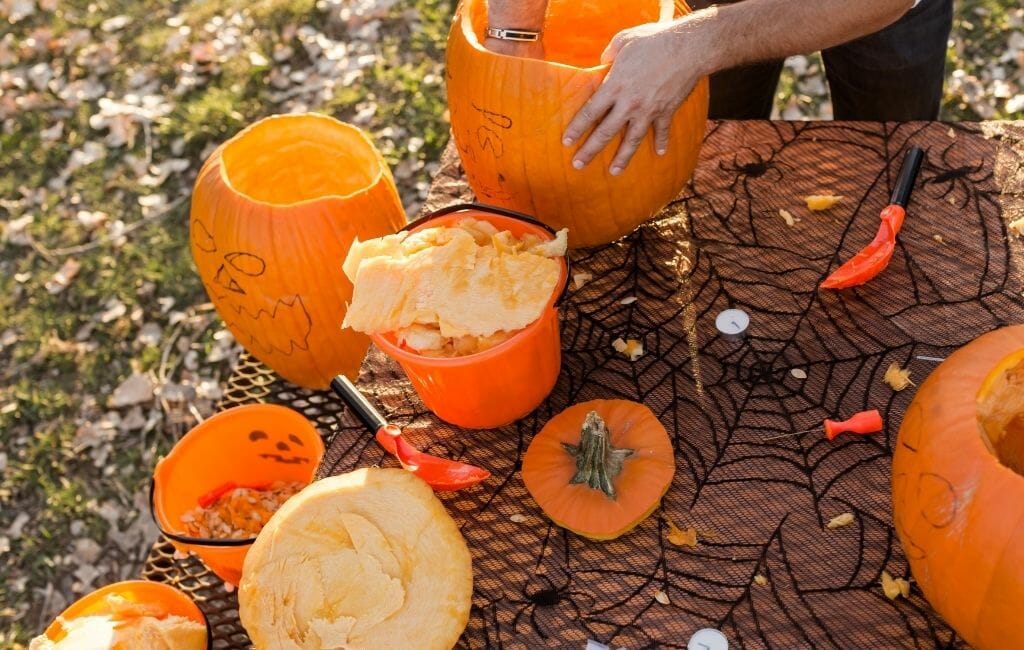 Pumpkin Carving Tabel with half finished carved pumpkins