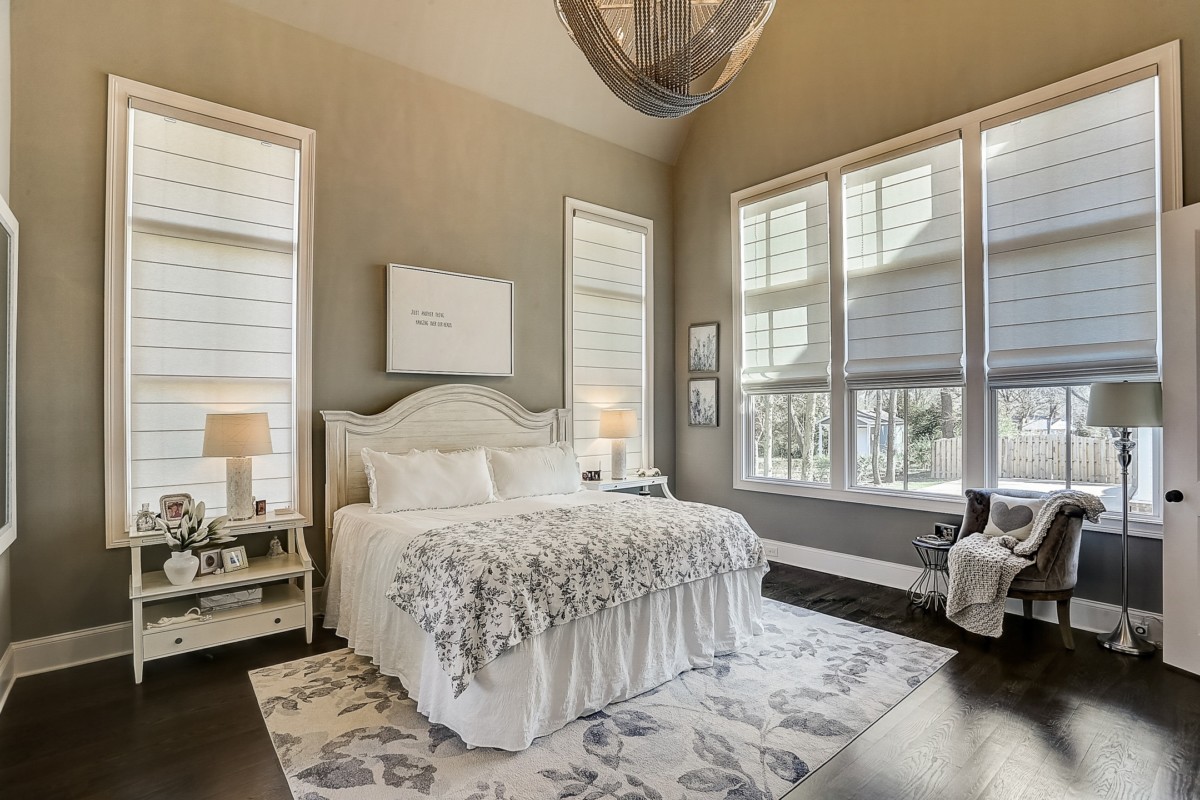 bedroom with lots of windows letting in light