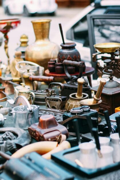 Antiques table with an assortment of crafts and trinkets
