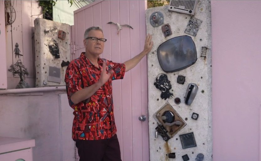 Pop historian Charles Phoenix, admiring a custom decorated outdoor panel.