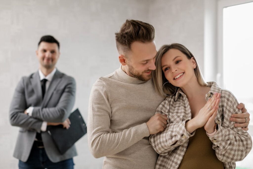 Happy couple satisfied with the design of their future home