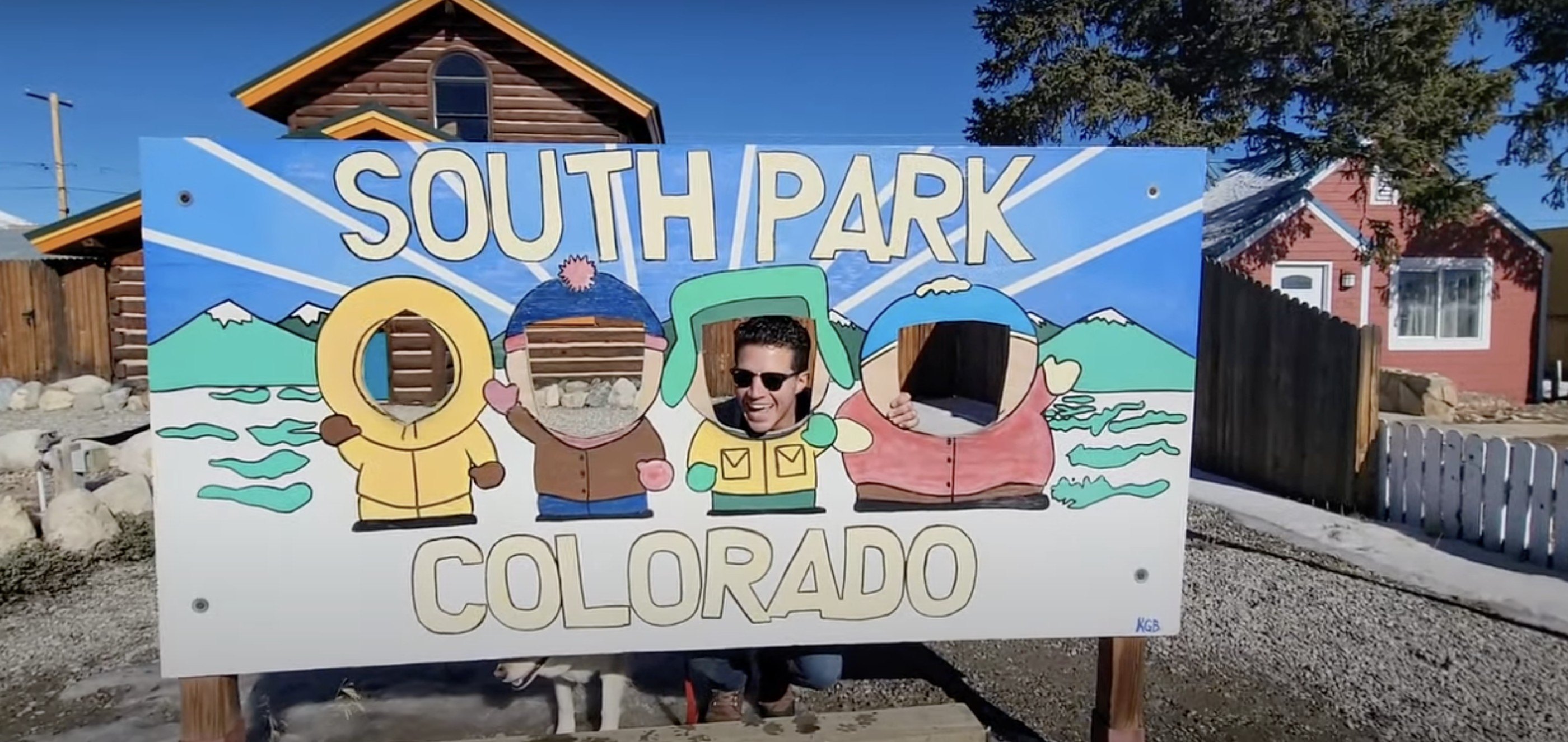 Sotheby's agent Anthony Sole shows off a South Park peep hole board in the South Park City outdoor museum in Fairplay, CO.