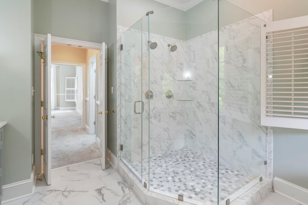 White marble tiled shower cabin