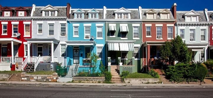 A row of colorful houses when settling into your new neighborhood