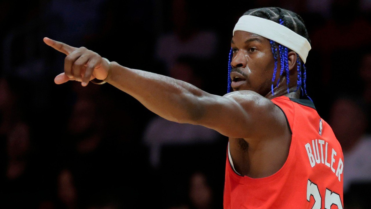 Miami Heat forward Jimmy Butler (22) signals on the court during the game against the Phoenix Suns at Kaseya Center in Miami on Saturday, Dec. 7, 2024. (Al Diaz/Miami Herald/Tribune News Service via Getty Images)