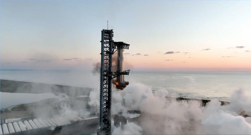 TEXAS, UNITED STATES - OCTOBER 13: (----EDITORIAL USE ONLY - MANDATORY CREDIT - SPACEX / HANDOUT' - NO MARKETING NO ADVERTISING CAMPAIGNS - DISTRIBUTED AS A SERVICE TO CLIENTS----) SpaceX successfully launched the latest test flight (5th) of Starship and for the first time, this demonstration mission included an attempt to maneuver the 232-foot-tall (71-meter) rocket booster to a gargantuan landing structure at the Starbase facility near Boca Chica Beach in Texas, United States on October 13, 2024. The Super Heavy was successfully caught midair on the first attempt with a pair of massive metal pincers, which SpaceX calls "chopsticks." (Photo by SpaceX / Handout/Anadolu via Getty Images)