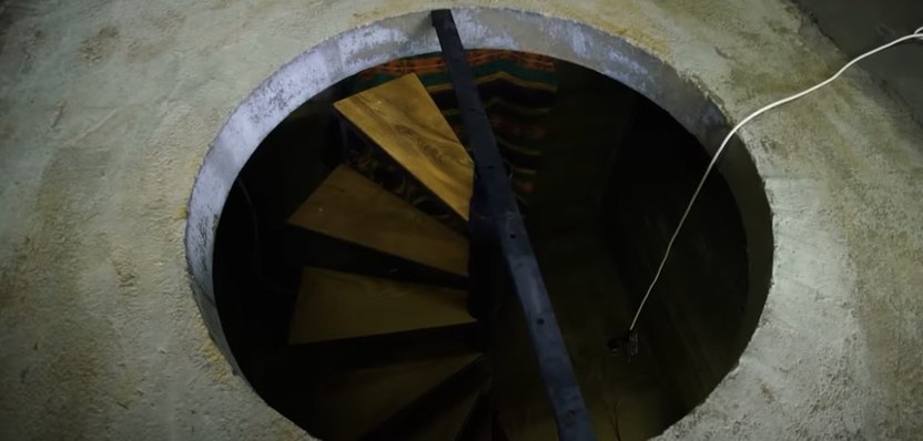 They crafted a round entry to the bunker, that would blend in with the floor above and be covered by a rug.