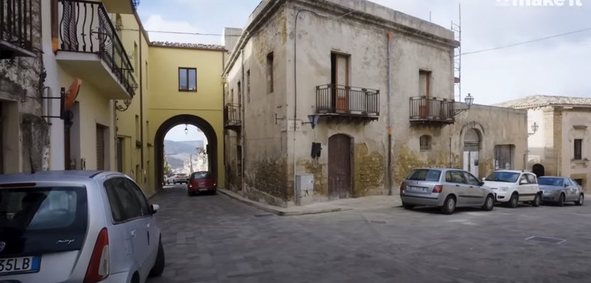 The original property was old, abandoned and shared a wall with the house next door.