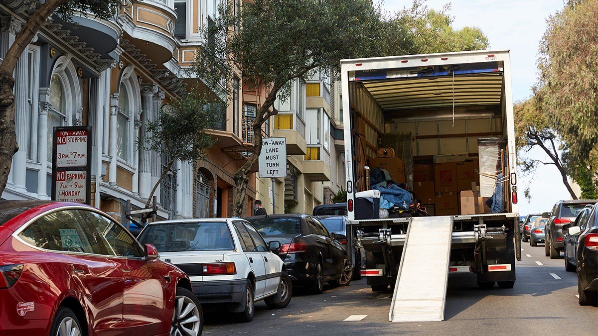 A moving truck being packed outside of a home in San Francisco, CA