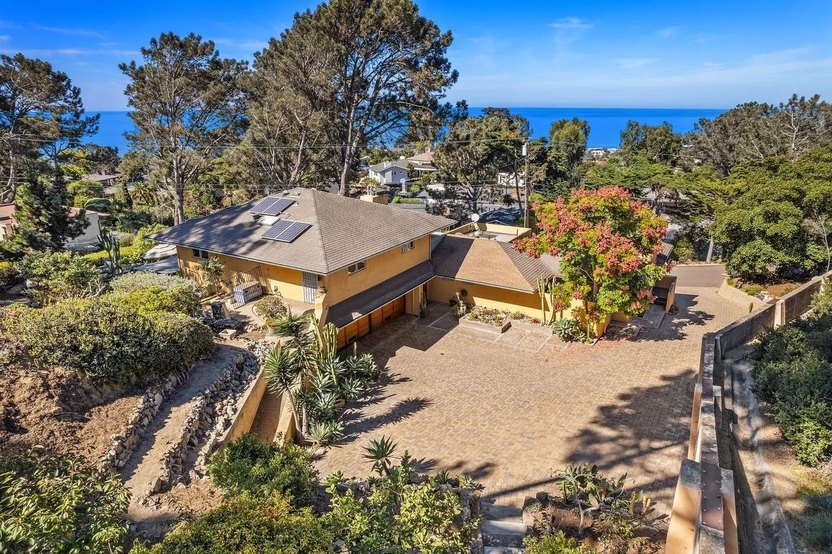 This Del Mar Pacific Ocean view house has signature Frank Lloyd Wright features like seamless corner windows.