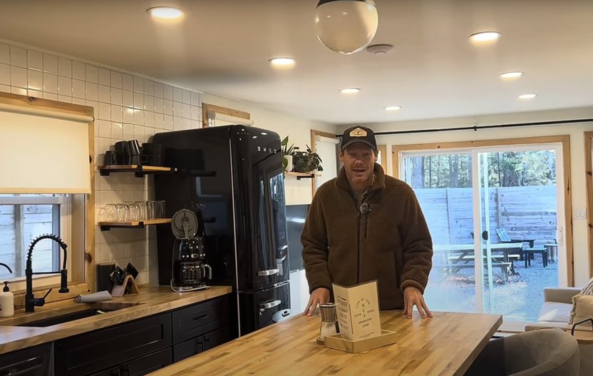 The decor and kitchen appliances are retro mountain chic.