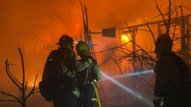 Firefighters battling the Woolsey Fire