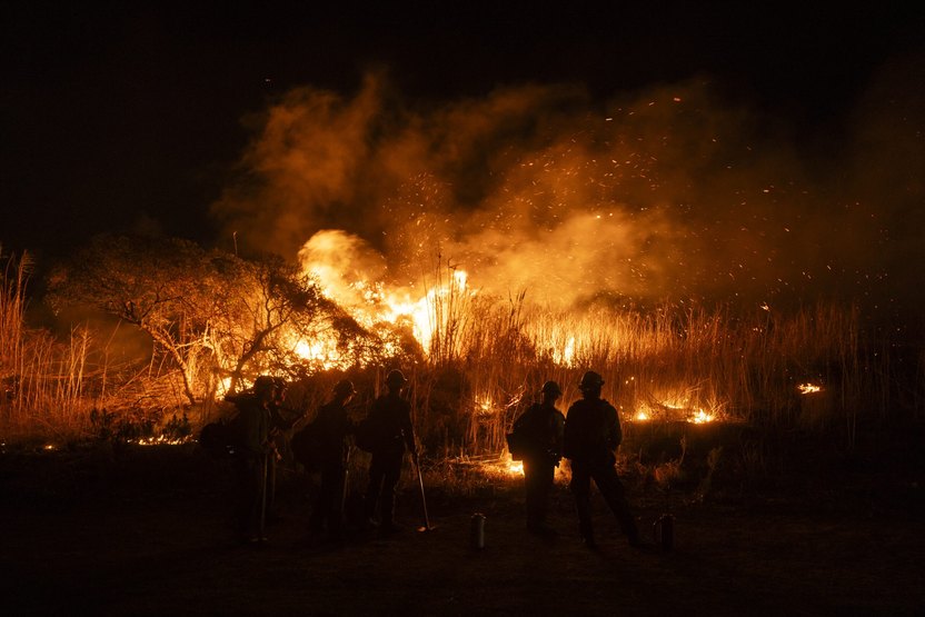Firefighters monitor and control the spread of the Auto Fire in Oxnard, North West of Los Angeles, California