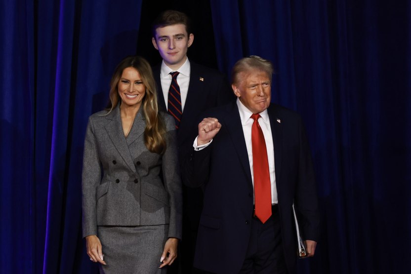 WEST PALM BEACH, FLORIDA - NOVEMBER 06: Republican presidential nominee, former U.S. President Donald Trump arrives to speak with former first lady Melania Trump and Barron Trump during an election night event at the Palm Beach Convention Center on November 06, 2024 in West Palm Beach, Florida. Americans cast their ballots today in the presidential race between Republican nominee former President Donald Trump and Vice President Kamala Harris, as well as multiple state elections that will determine the balance of power in Congress. (Photo by Joe Raedle/Getty Images)